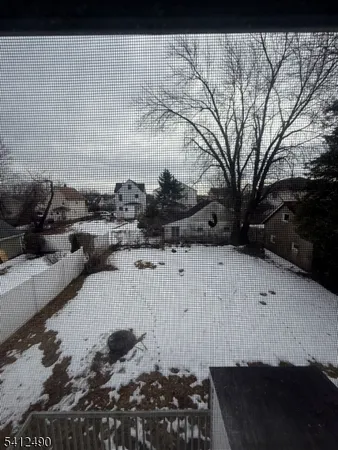 a view of a backyard of the house
