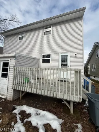 a side view of a house with a yard