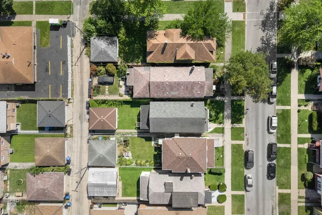 an aerial view of houses with outdoor space