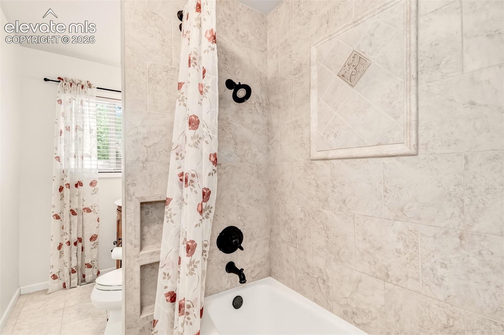 1250 Osgood Road Colorado Springs, CO 80915 - Photo 12 of 30 Updated Guest Bathroom With Custom Tile And Built-Ins