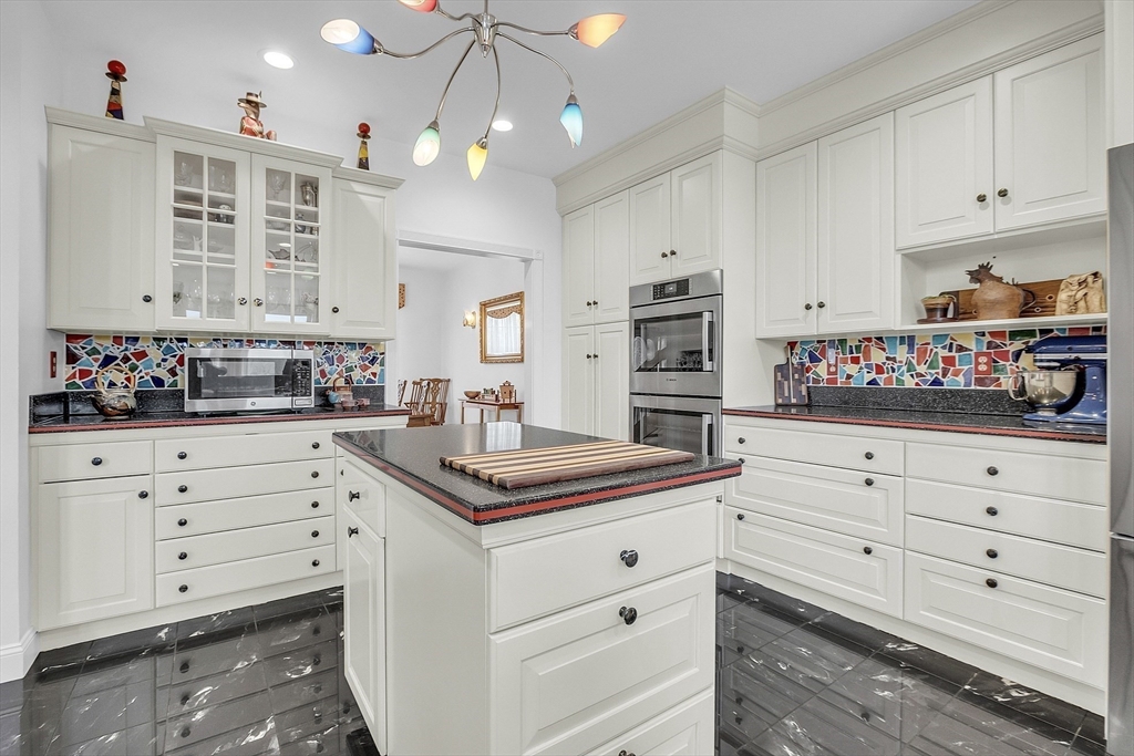148 Houghton Road Princeton, MA 01541 - Photo 12 of 42 a kitchen with stainless steel appliances white cabinets and a sink