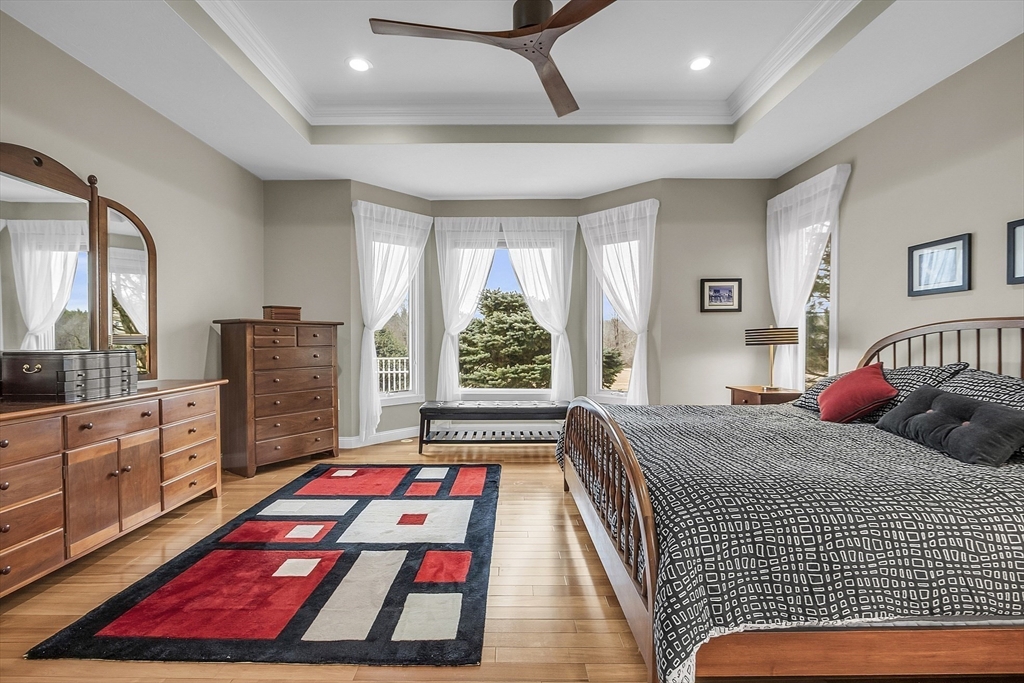 148 Houghton Road Princeton, MA 01541 - Photo 23 of 42 a bedroom with a bed a dresser a mirror and furniture