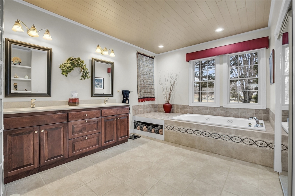 148 Houghton Road Princeton, MA 01541 - Photo 25 of 42 a spacious bathroom with a granite countertop tub sink and mirror