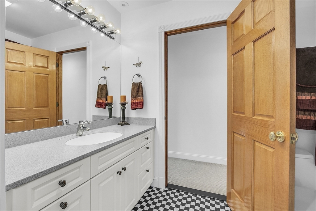 148 Houghton Road Princeton, MA 01541 - Photo 29 of 42 a bathroom with a shower sink and mirror