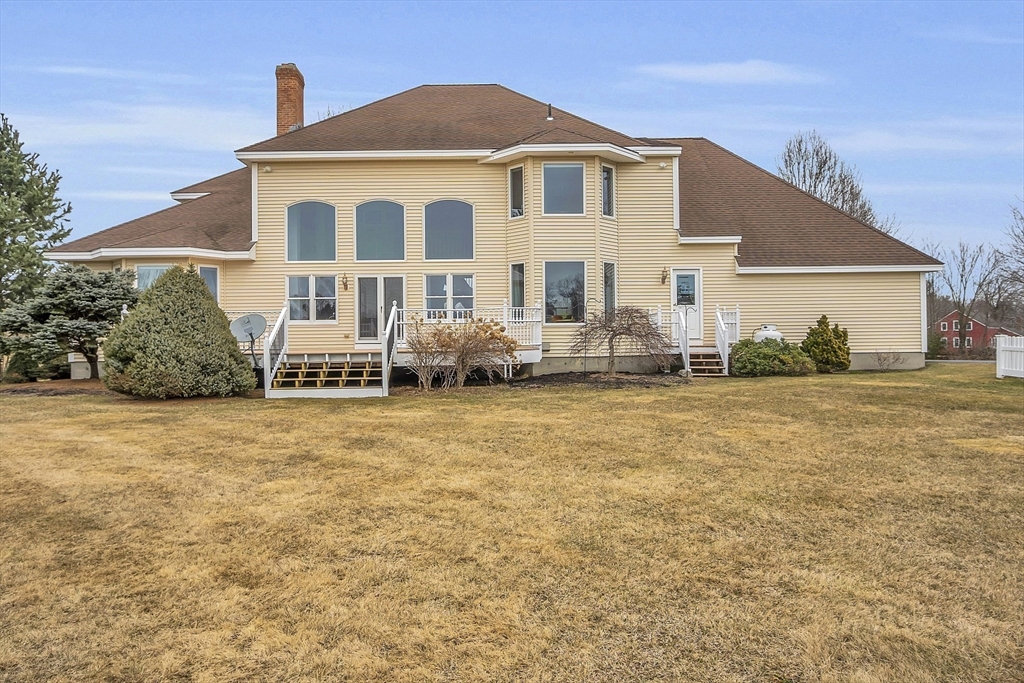 148 Houghton Road Princeton, MA 01541 - Photo 3 of 42 a front view of a house with a yard
