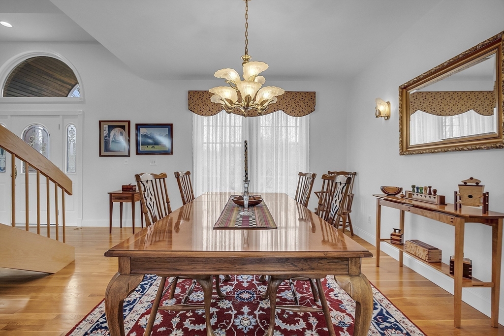 148 Houghton Road Princeton, MA 01541 - Photo 8 of 42 a view of a dining room with furniture and a chandelier