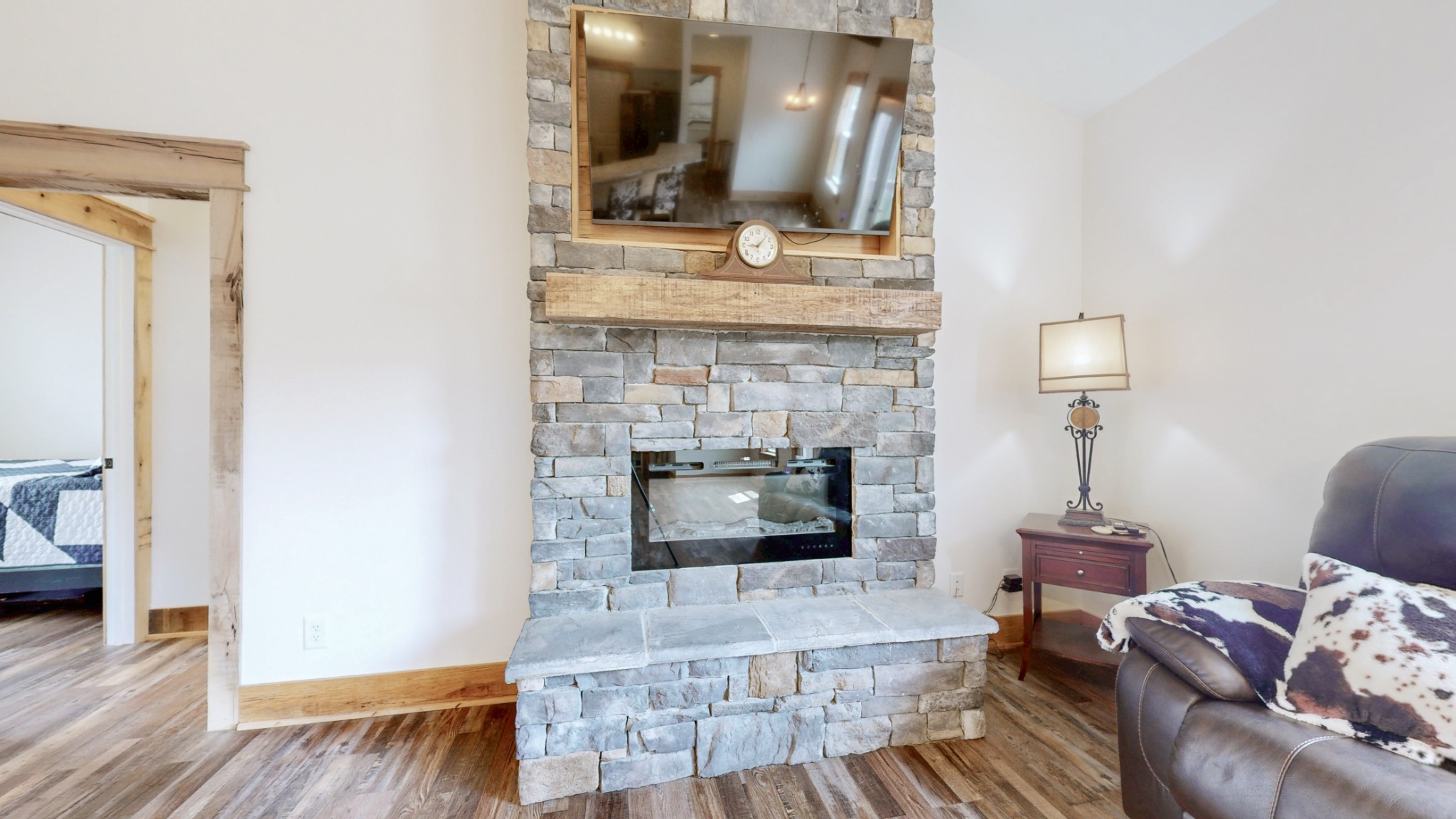 601 King Ridge Road Dowelltown, TN 37059 - Photo 11 of 49 a living room with furniture and a fireplace with wooden floor