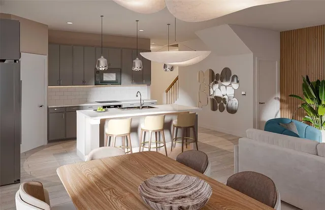 a living room with furniture a dining table and a fireplace