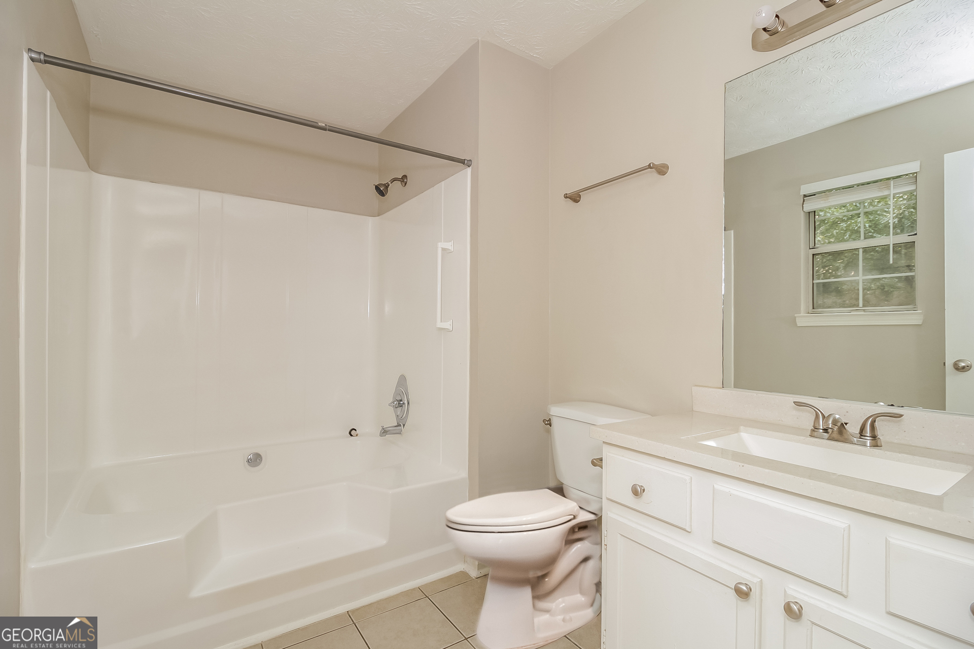 124 Emerald Pines Drive Dallas, GA 30157 - Photo 13 of 17 a bathroom with a sink a toilet and shower