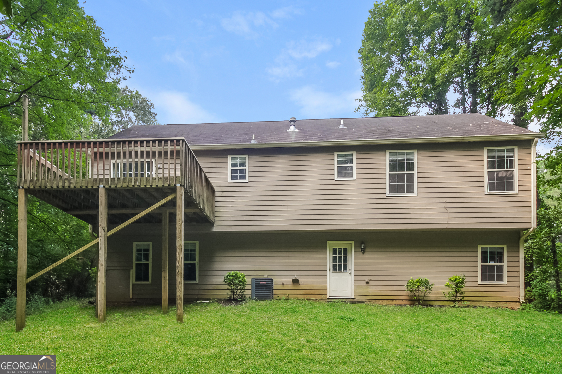124 Emerald Pines Drive Dallas, GA 30157 - Photo 15 of 17 a view of a house with a yard and a large tree