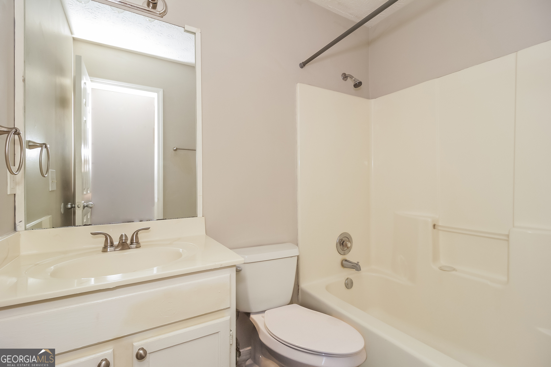 124 Emerald Pines Drive Dallas, GA 30157 - Photo 10 of 17 a bathroom with a sink a toilet and shower