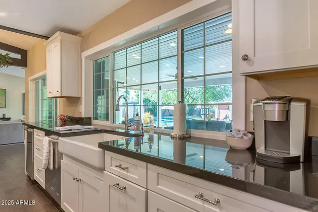a view of a livingroom with furniture and a window
