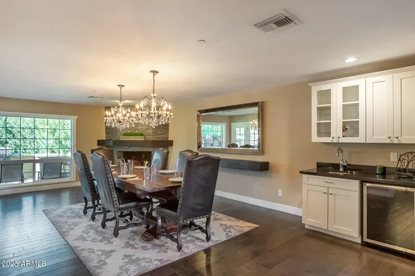 a bathroom with a granite countertop sink toilet and mirror