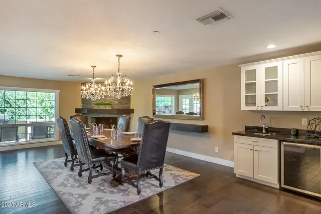 a bathroom with a granite countertop sink toilet and mirror