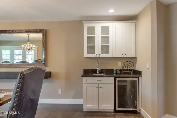 a bedroom with furniture and a flat screen tv