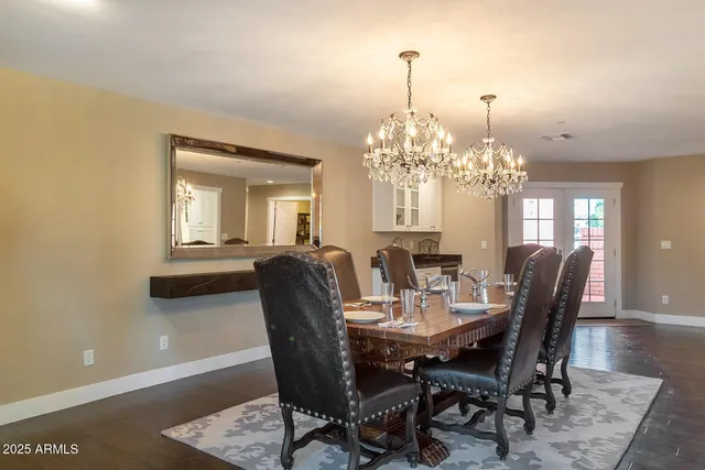 a bedroom with a large bed and ceiling fan