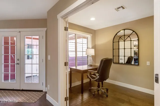a bathroom with a granite countertop sink a toilet and shower