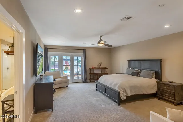 a kitchen with white cabinets and refrigerator