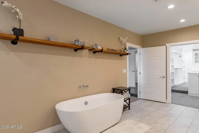 a living room with furniture and large windows