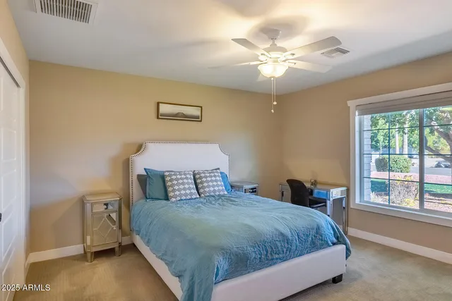 a view of a livingroom with furniture and a window
