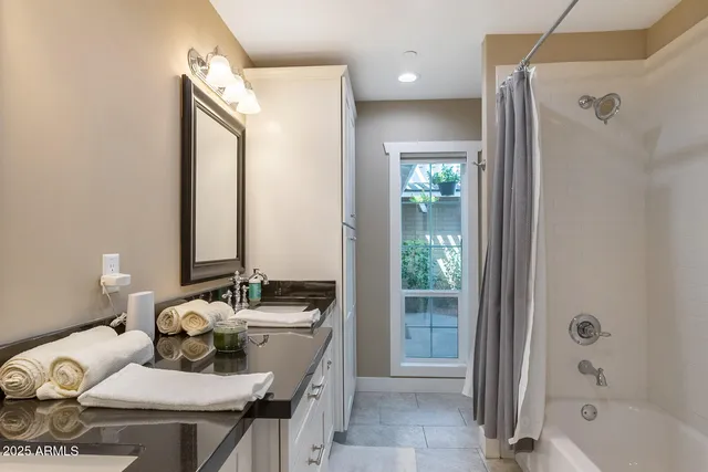 a bedroom with a bed and cabinets