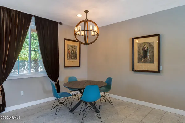 a view of a house with swimming pool and sitting area