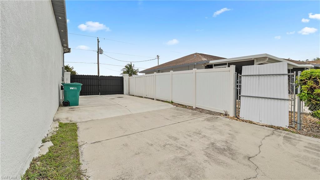 2998 52nd Street Southwest Naples, FL 34116 - Photo 33 of 44 View of patio featuring a gate