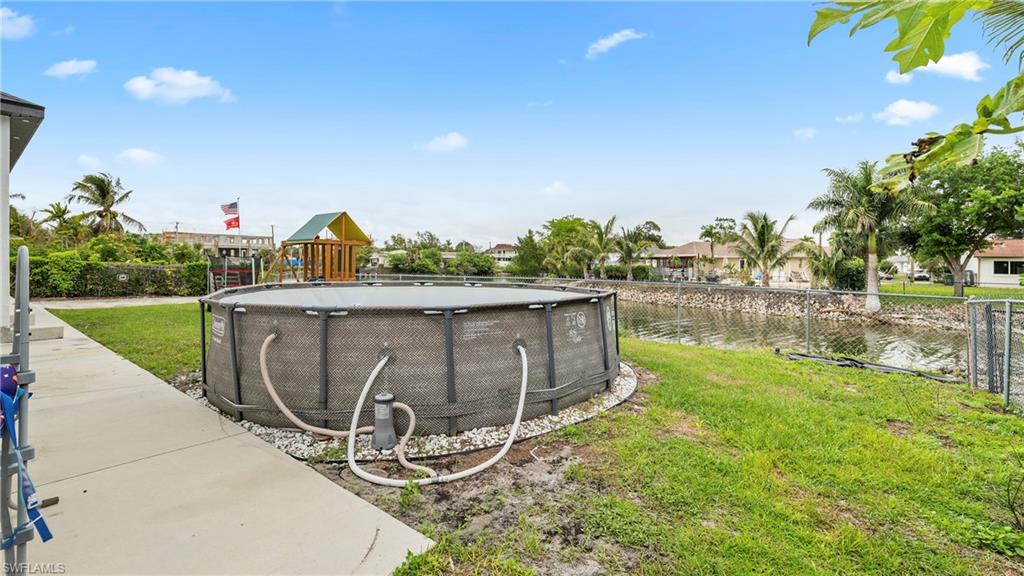 2998 52nd Street Southwest Naples, FL 34116 - Photo 36 of 44 Fenced yard with a water view