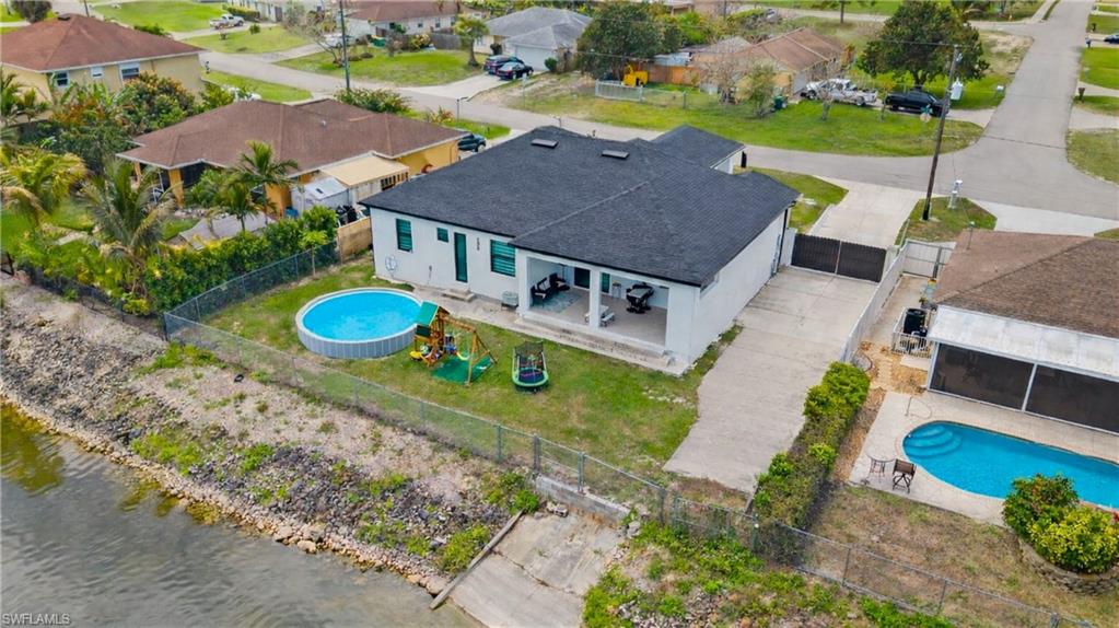 2998 52nd Street Southwest Naples, FL 34116 - Photo 38 of 44 Aerial view of residential area featuring a pool area