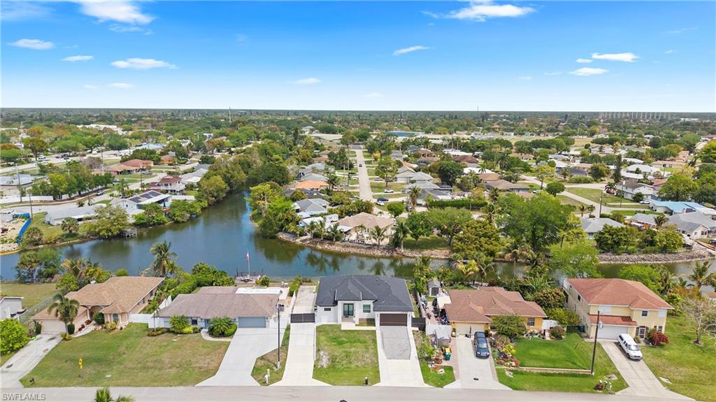 2998 52nd Street Southwest Naples, FL 34116 - Photo 39 of 44 Aerial perspective of suburban area with a nearby body of water