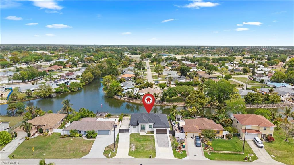 2998 52nd Street Southwest Naples, FL 34116 - Photo 40 of 44 Aerial perspective of suburban area with a large body of water