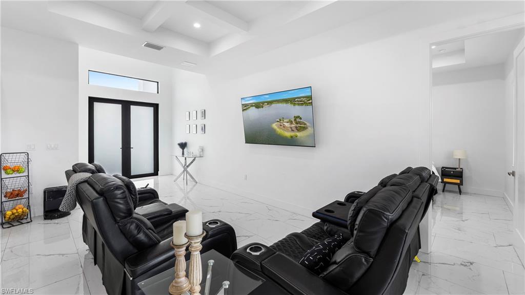 2998 52nd Street Southwest Naples, FL 34116 - Photo 5 of 44 Living area with coffered ceiling, recessed lighting, french doors, and light marble finish floors
