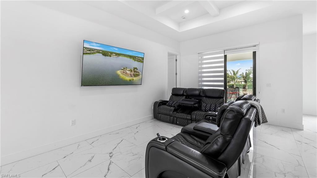 2998 52nd Street Southwest Naples, FL 34116 - Photo 8 of 44 Living area featuring coffered ceiling, light marble finish floors, and recessed lighting