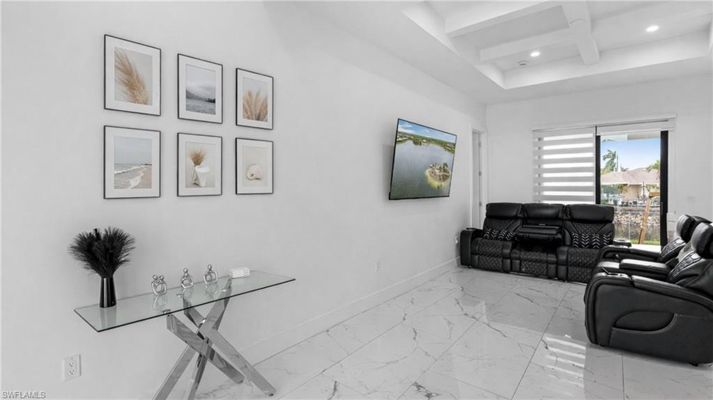 2998 52nd Street Southwest Naples, FL 34116 - Photo 9 of 44 Living area featuring coffered ceiling, recessed lighting, and light marble finish floors