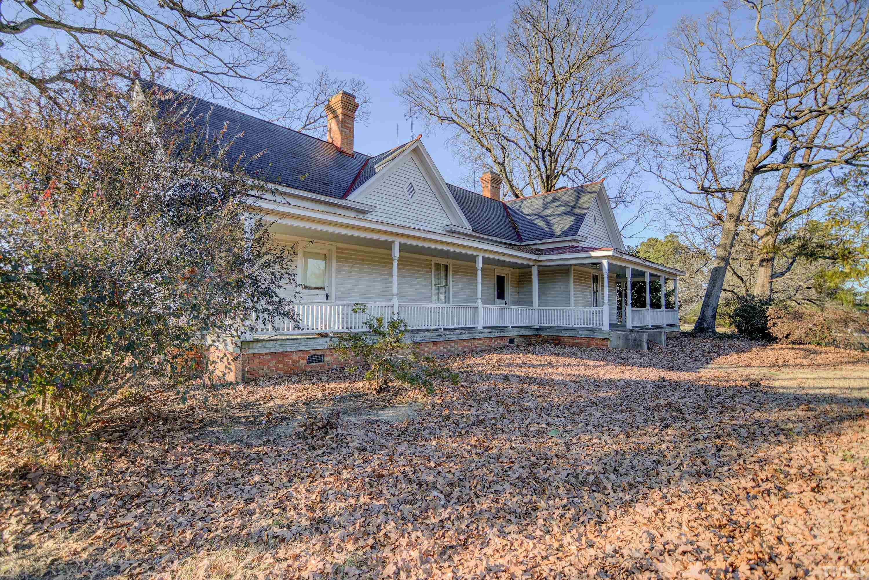 4740 Auburn Knightdale Road Raleigh, NC 27610 - Photo 1 of 23 a front view of a house with garden