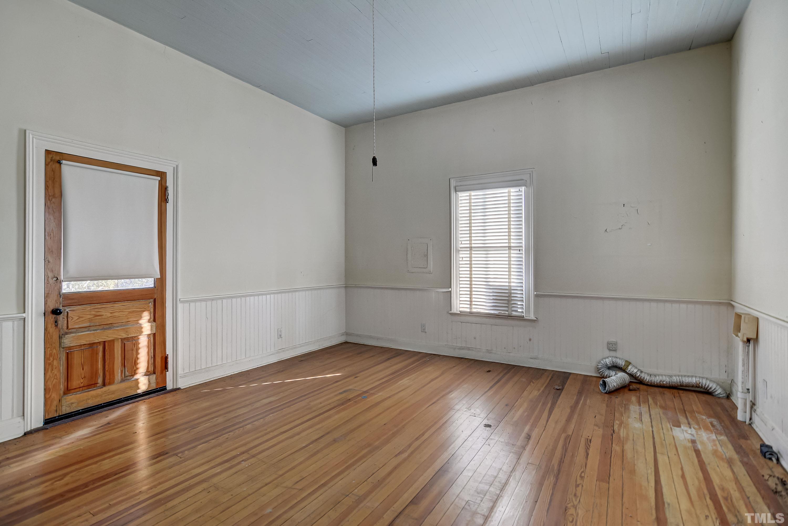 4740 Auburn Knightdale Road Raleigh, NC 27610 - Photo 14 of 23 an empty room with wooden floor and windows