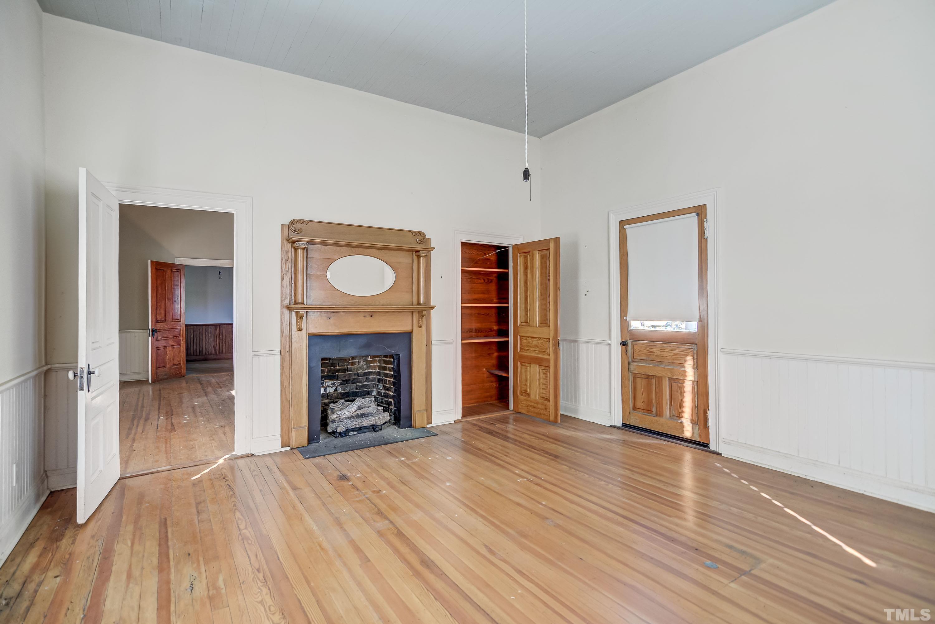 4740 Auburn Knightdale Road Raleigh, NC 27610 - Photo 15 of 23 a view of an empty room with a fireplace and a window