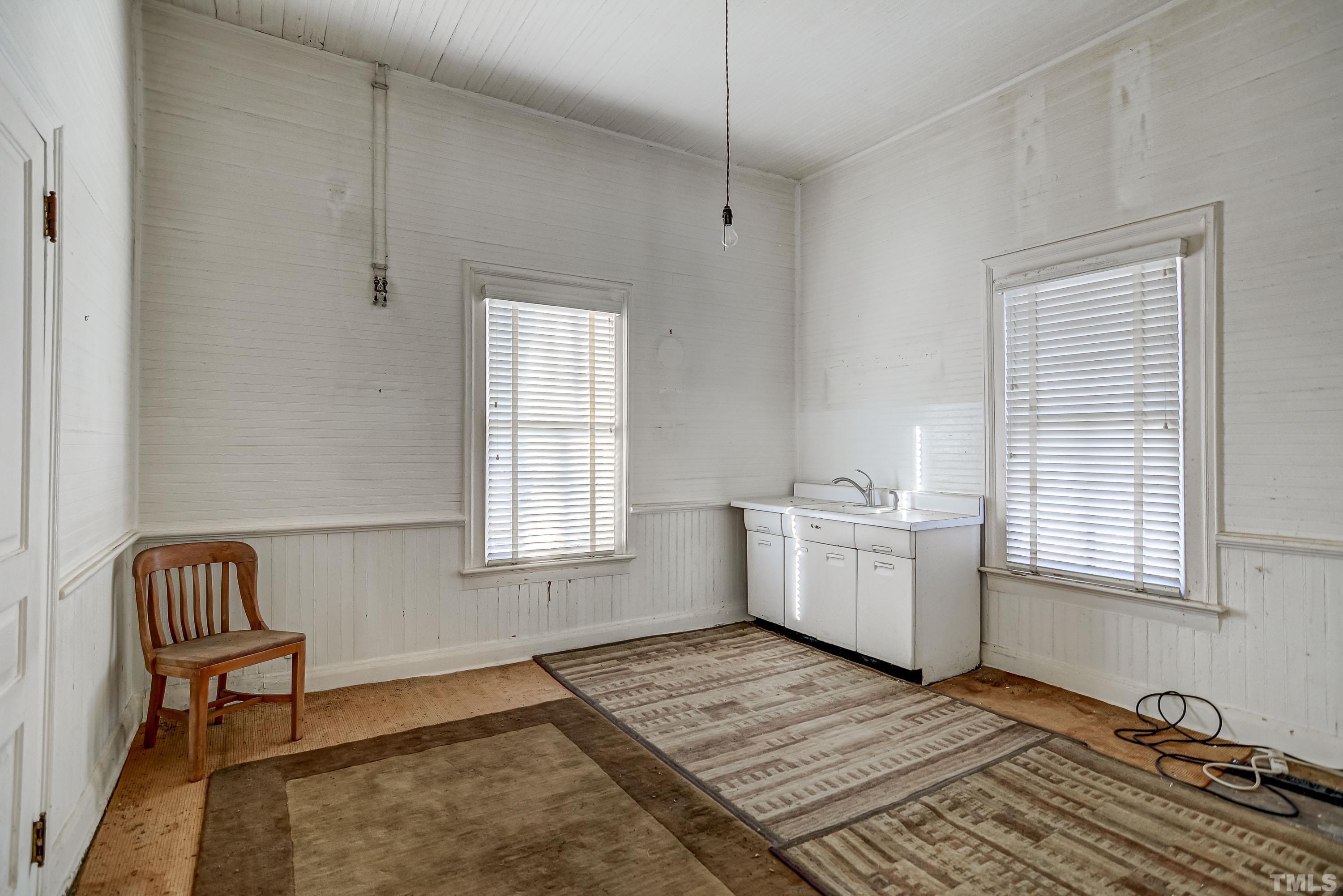 4740 Auburn Knightdale Road Raleigh, NC 27610 - Photo 17 of 23 a room with a couch and wooden floor