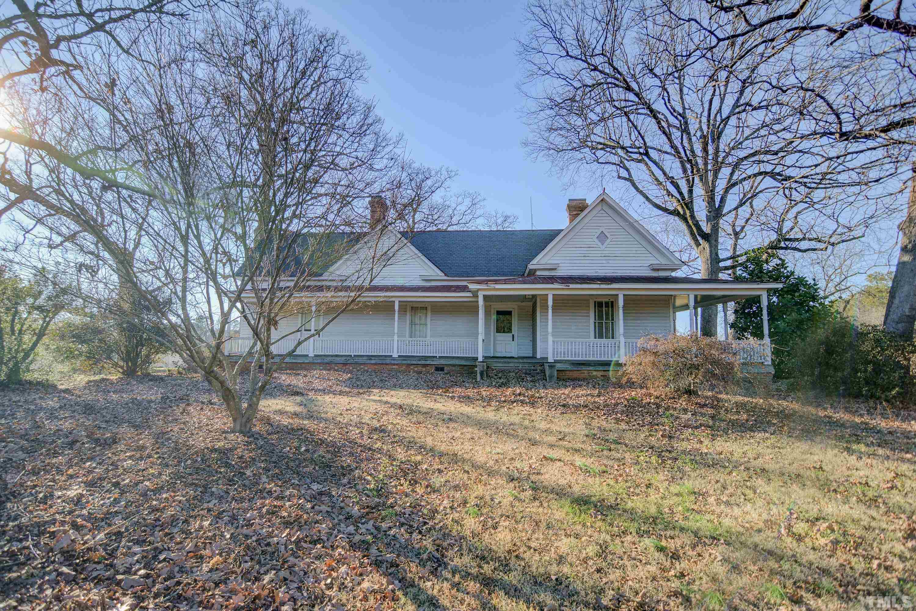 4740 Auburn Knightdale Road Raleigh, NC 27610 - Photo 3 of 23 a front view of a house with a garden