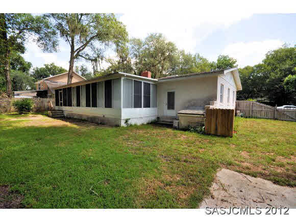 526 Jasmine Road St. Augustine, FL 32086 - Photo 12 of 18 a front view of house with yard and trees in the background