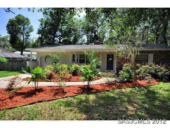 526 Jasmine Road St. Augustine, FL 32086 - Photo 2 of 18 a view of a backyard with plants and a garden