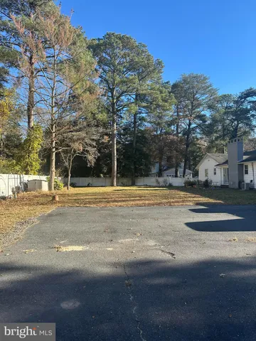 a view of street with tall buildings