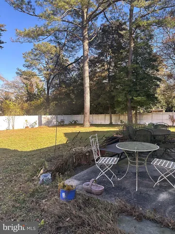 a view of a backyard with sitting area