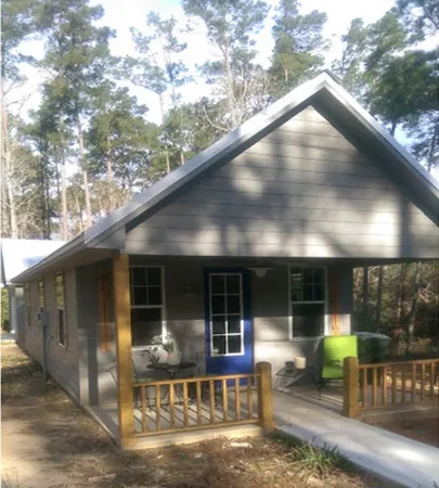 a view of sitting area in front of house