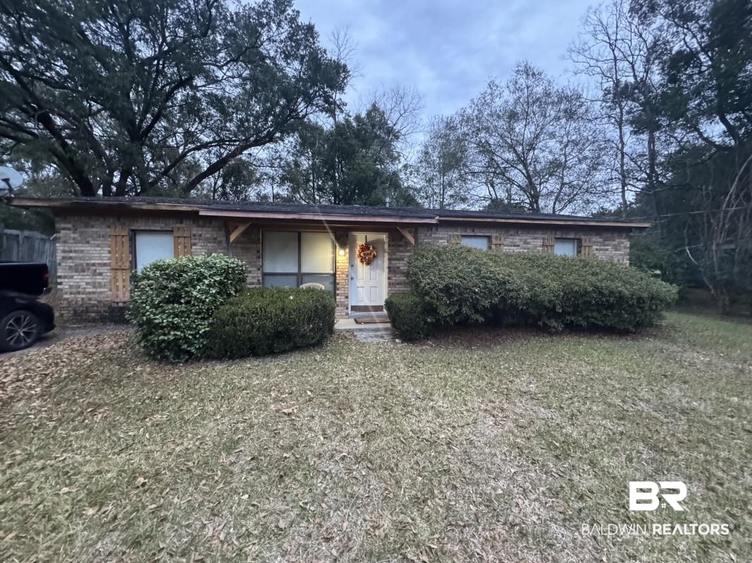 1302 Best Drive Mobile, AL 36608 - Photo 1 of 5 Ranch-style house featuring a front lawn and brick siding