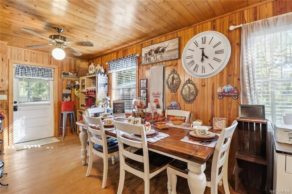 8110 Southwest 88th Lane Trenton, FL 32693 - Photo 11 of 29 a view of a dining room with furniture window and wooden floor