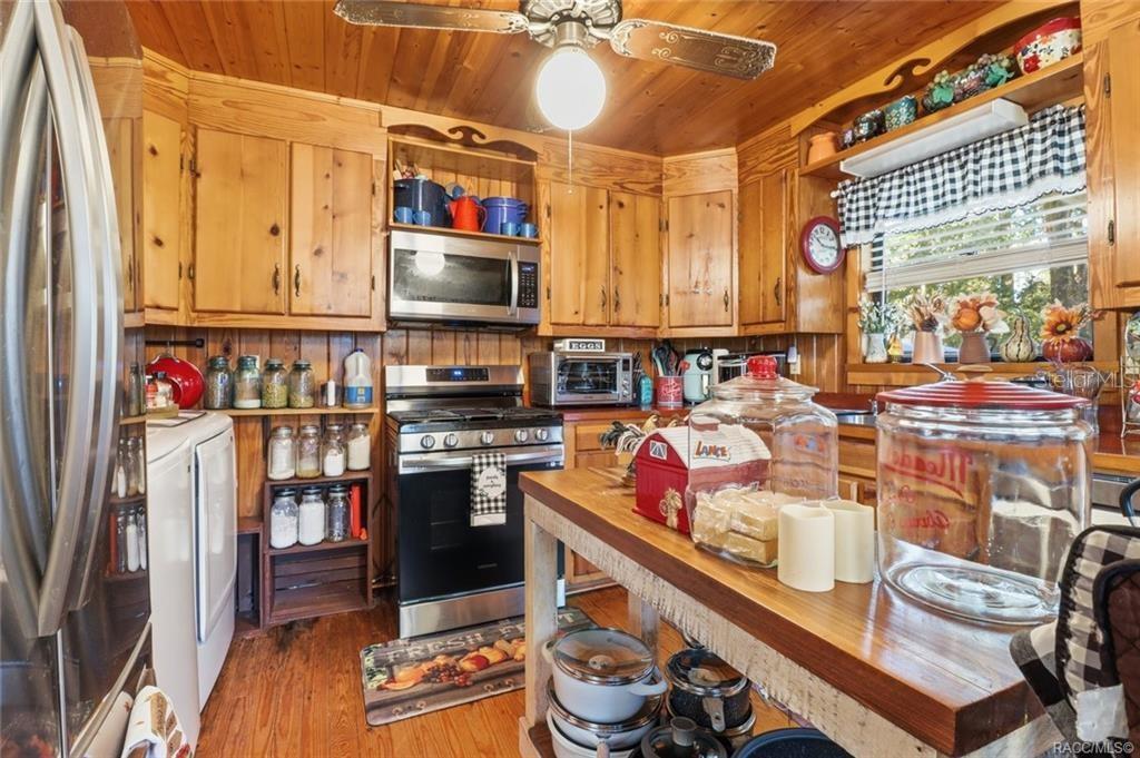 8110 Southwest 88th Lane Trenton, FL 32693 - Photo 14 of 29 a kitchen with stainless steel appliances a stove and a refrigerator