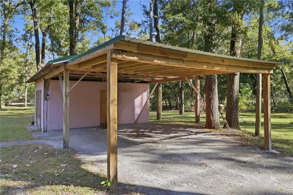 8110 Southwest 88th Lane Trenton, FL 32693 - Photo 24 of 29 a front view of a house with garden