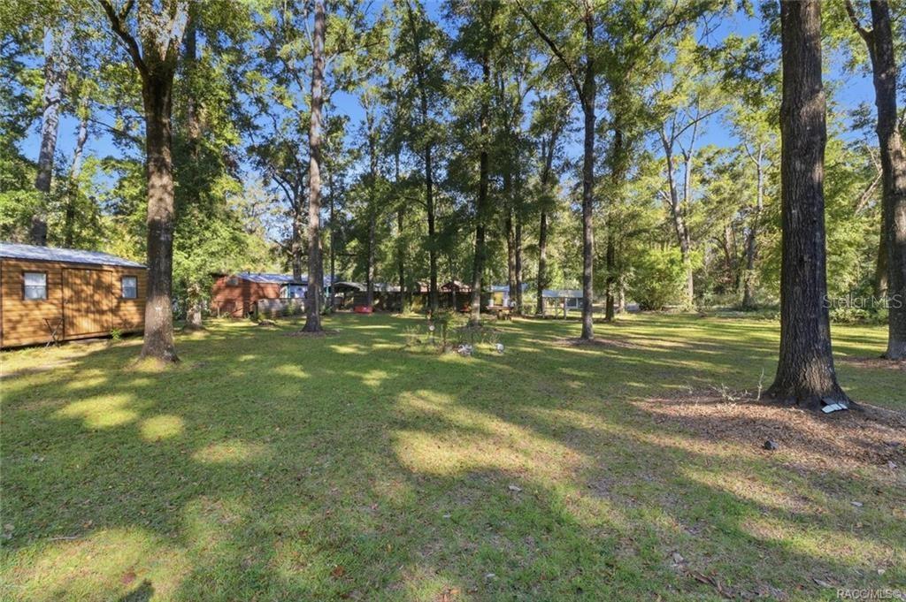 8110 Southwest 88th Lane Trenton, FL 32693 - Photo 27 of 29 a view of outdoor space with trees all around