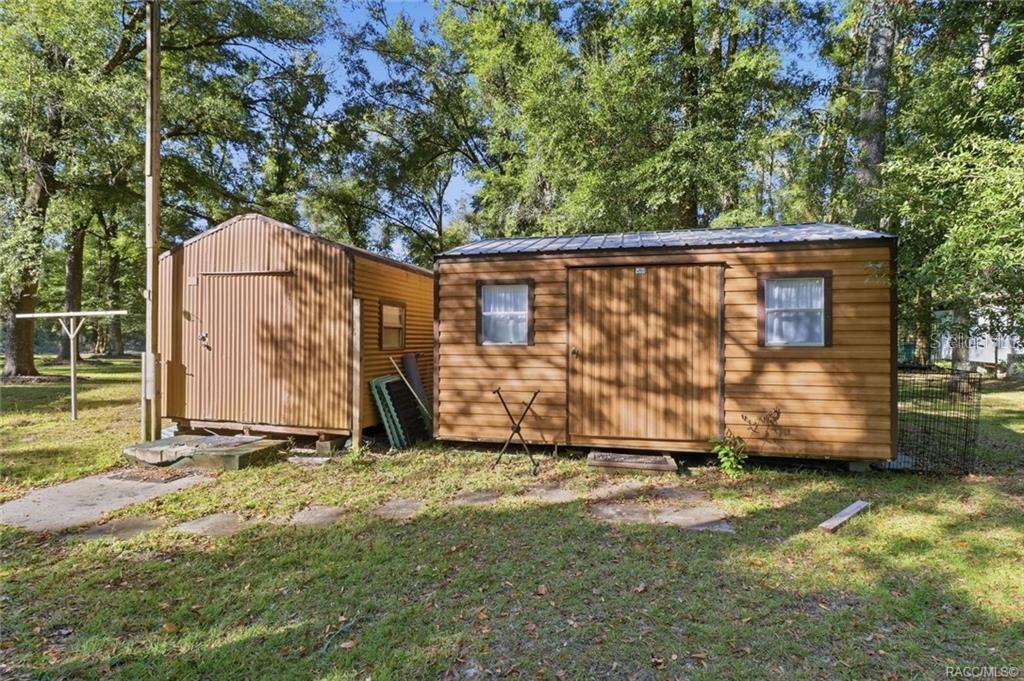 8110 Southwest 88th Lane Trenton, FL 32693 - Photo 28 of 29 a view of backyard with blue wall